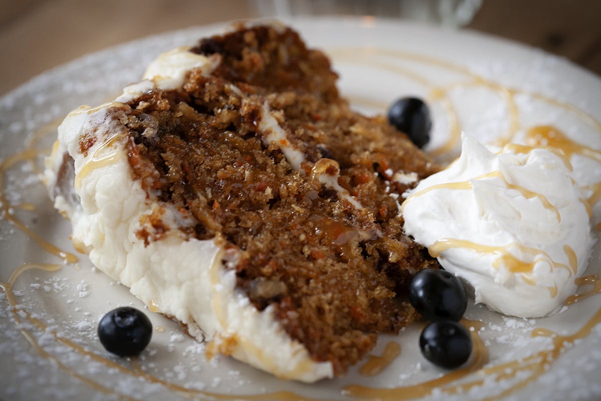 a piece of cake and ice cream on a plate