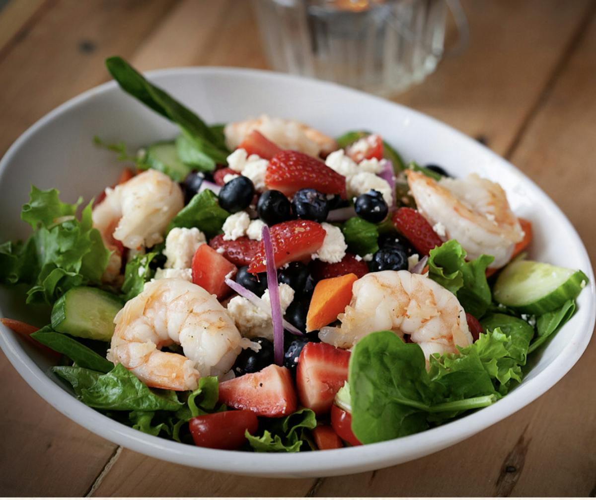 a bowl of salad on a plate