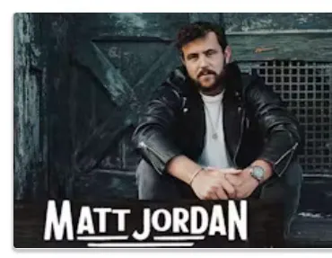 a man sitting in front of a door