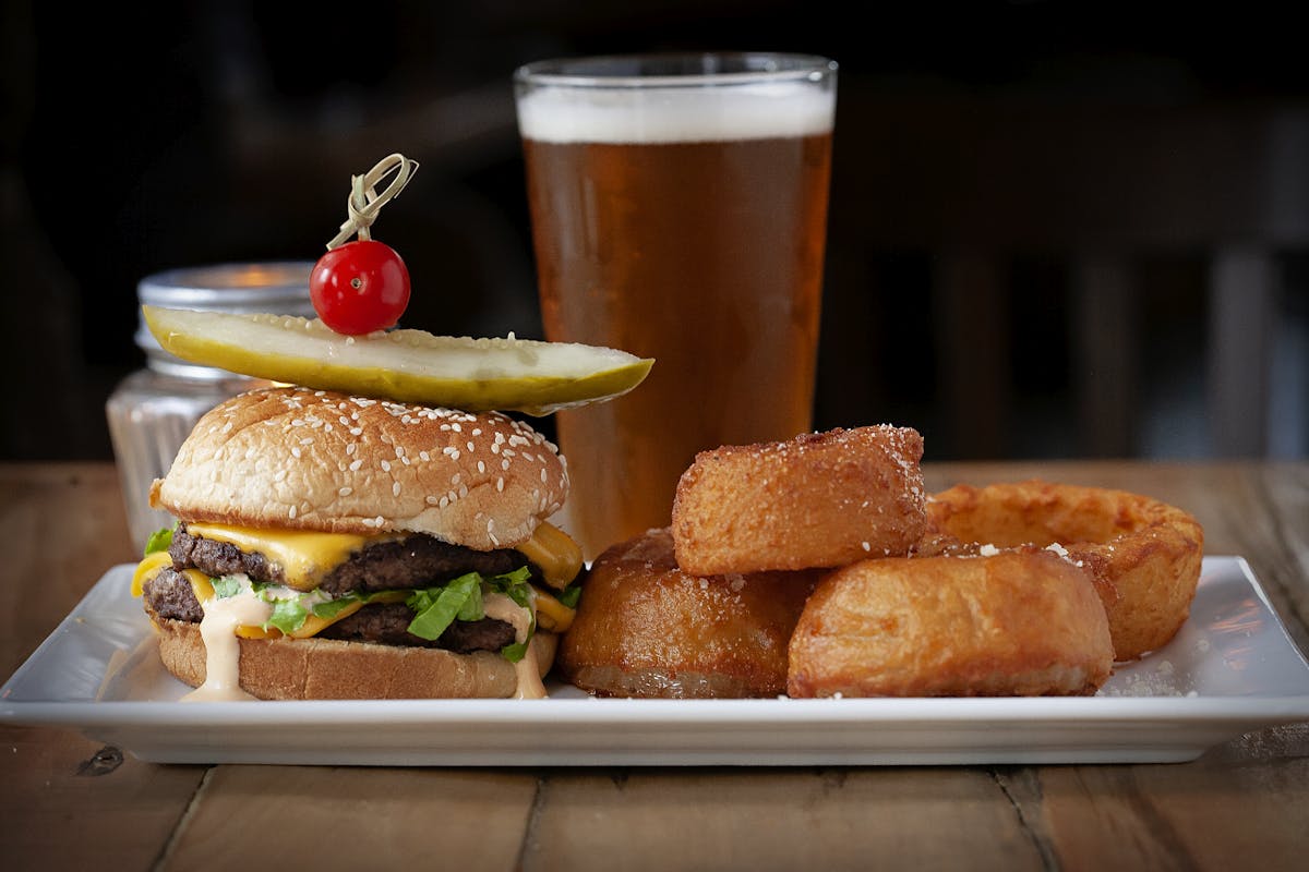 a plate of food with a sandwich and a cup of coffee