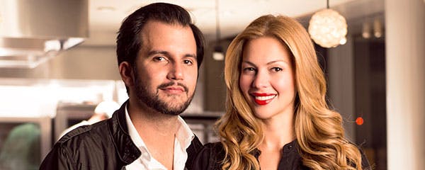 a man and a woman posing for the camera