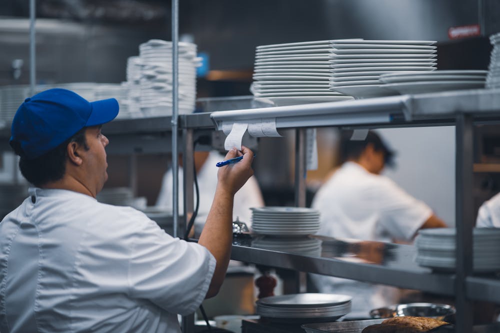 a man preparing food in a kitchen