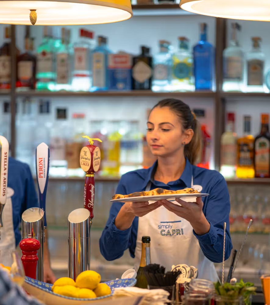 a person sitting at a table in front of a store
