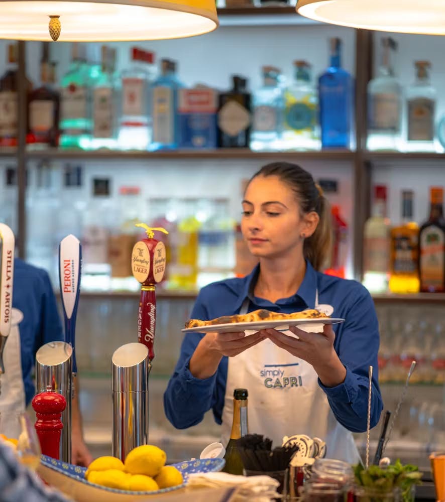 a person sitting at a table in front of a store