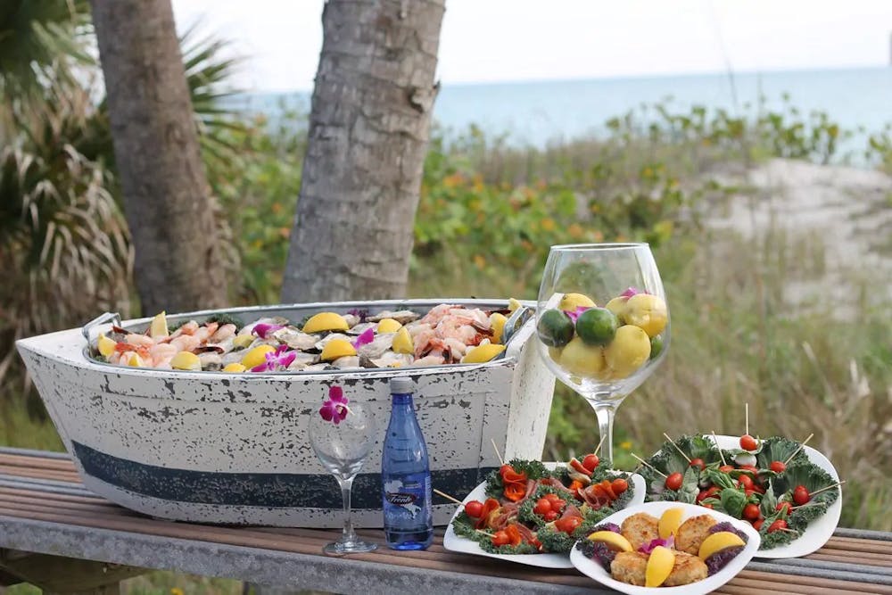 a bowl of fruit sitting on top of a picnic table