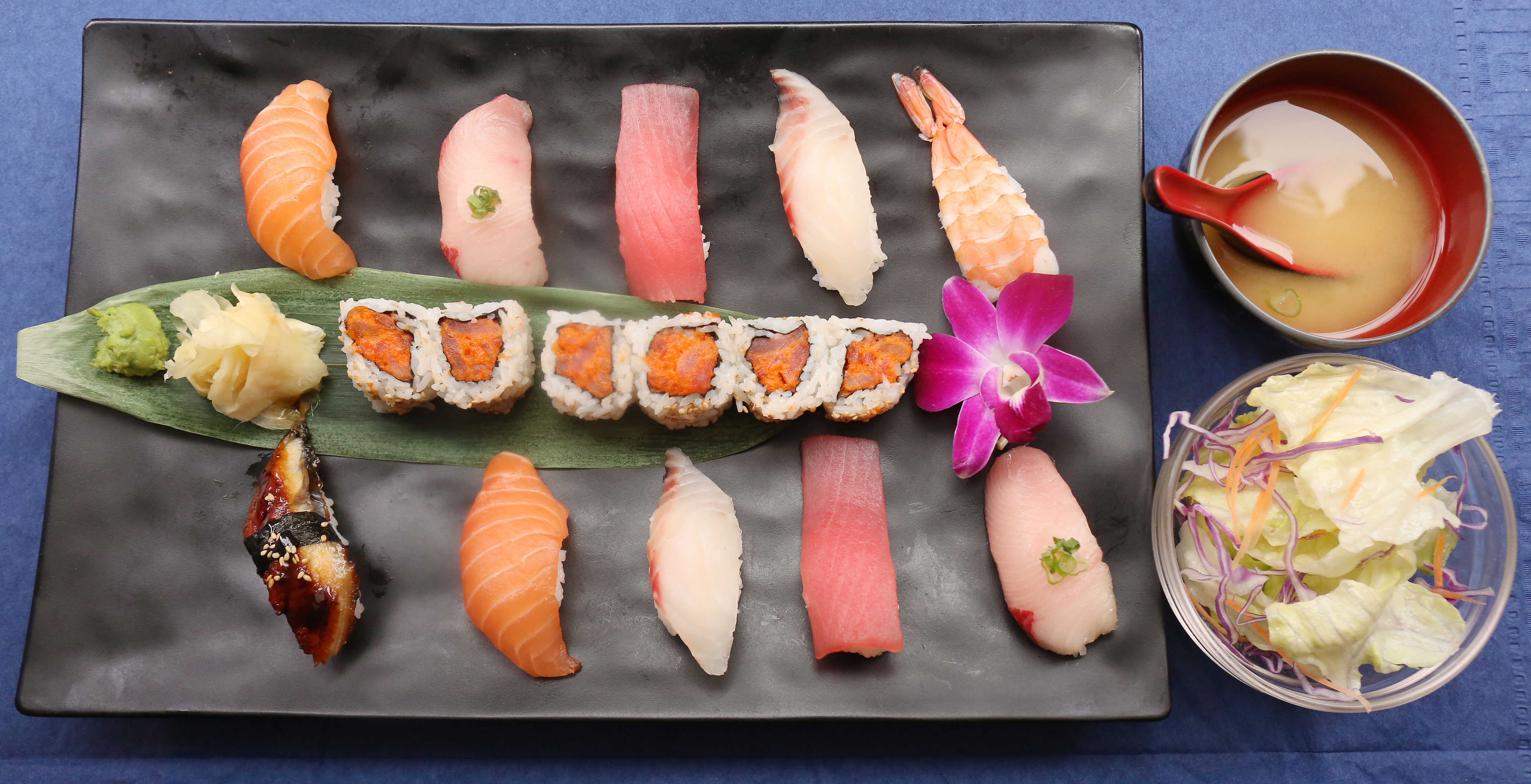 spicytuna roll with variety of nigiri sushi