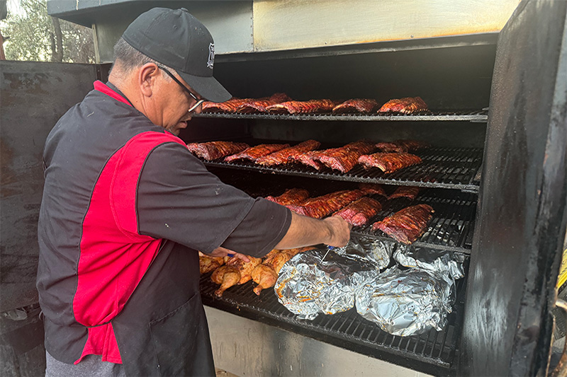 Tavern 101 preparing BBQ meats for party catering near Malibu Lake, California.