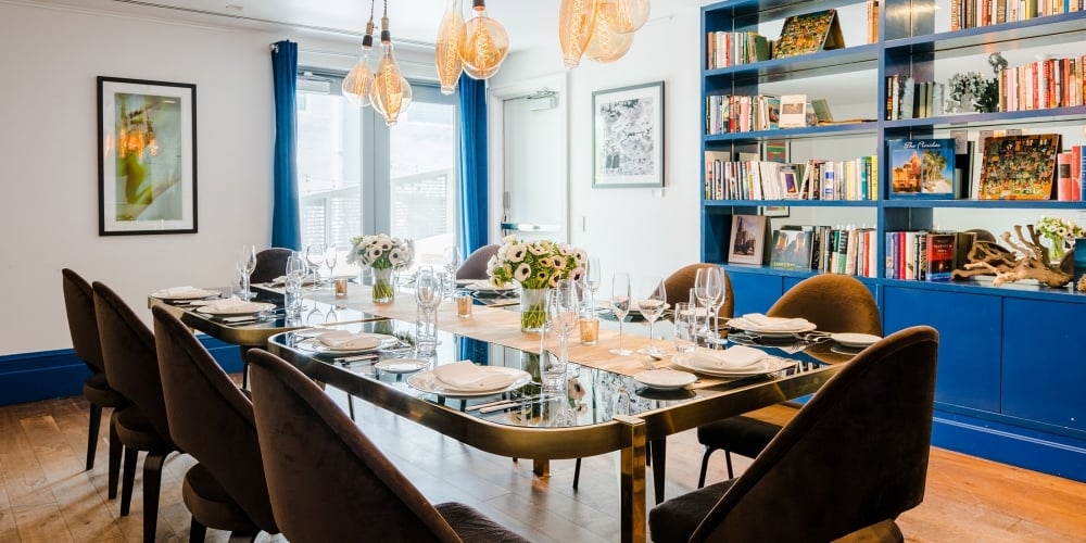 a dining room with tables and chairs