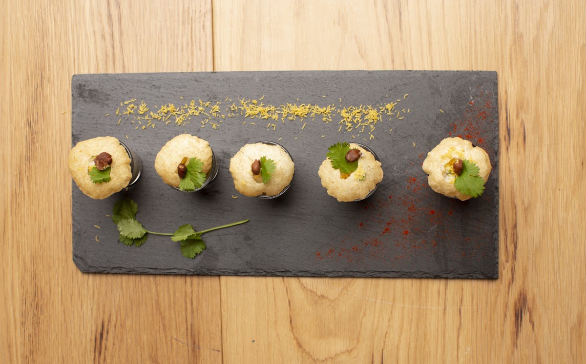 a bunch of food sitting on top of a wooden cutting board