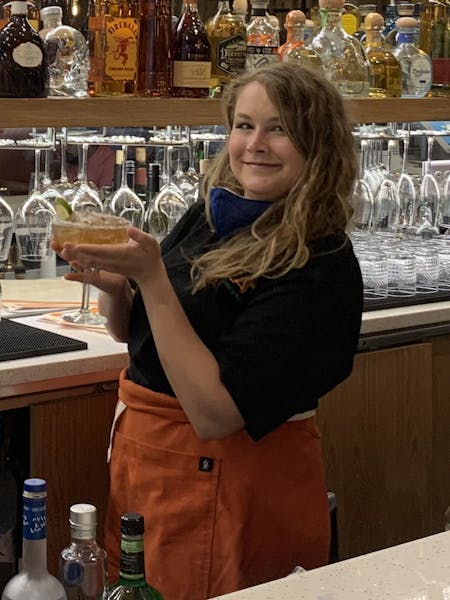 a person standing in front of a store