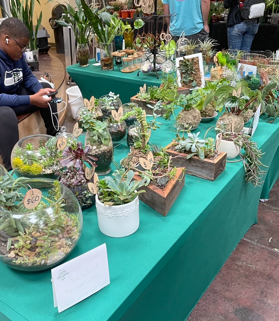 a group of people standing in a garden