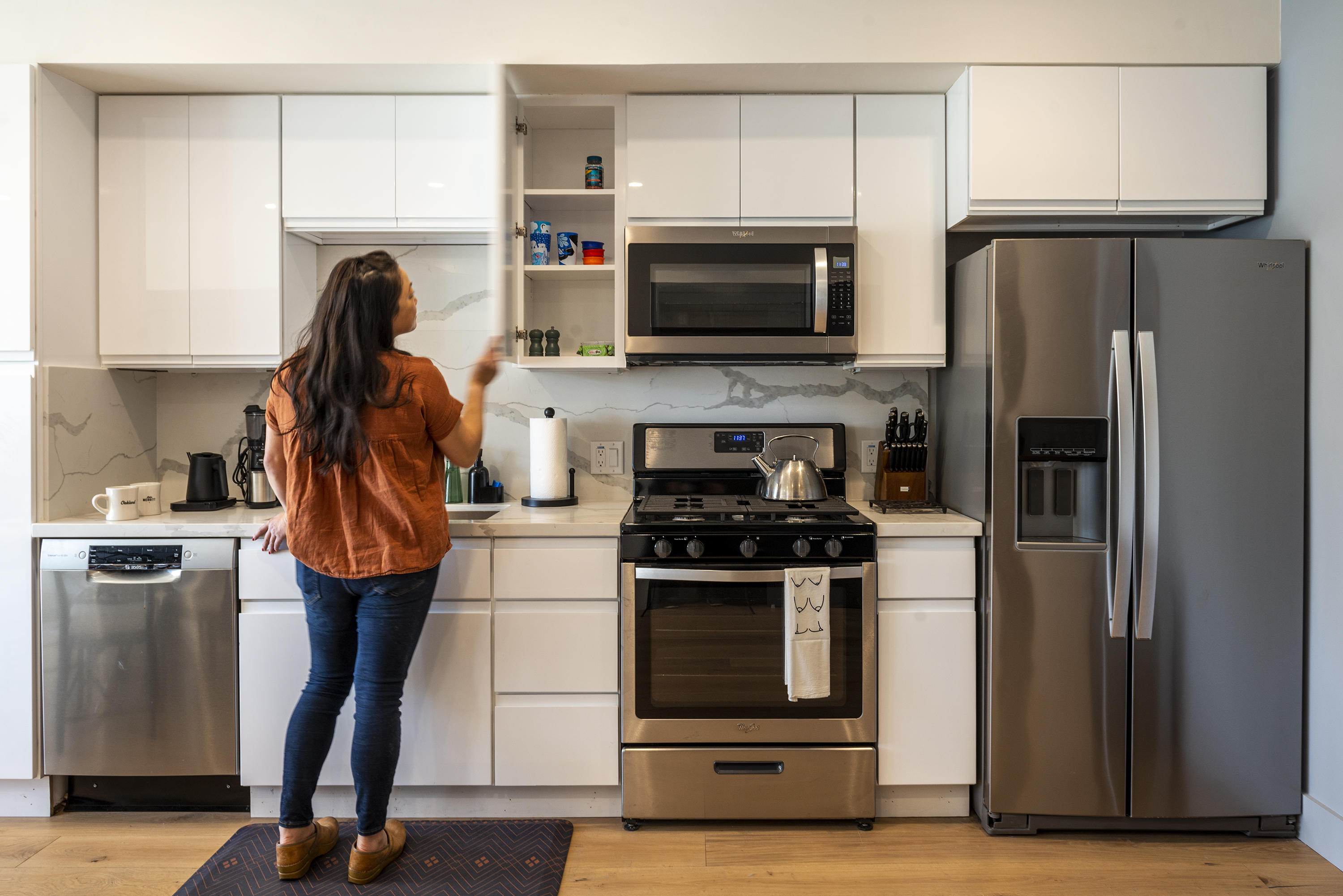 a woman standing in a kitchen