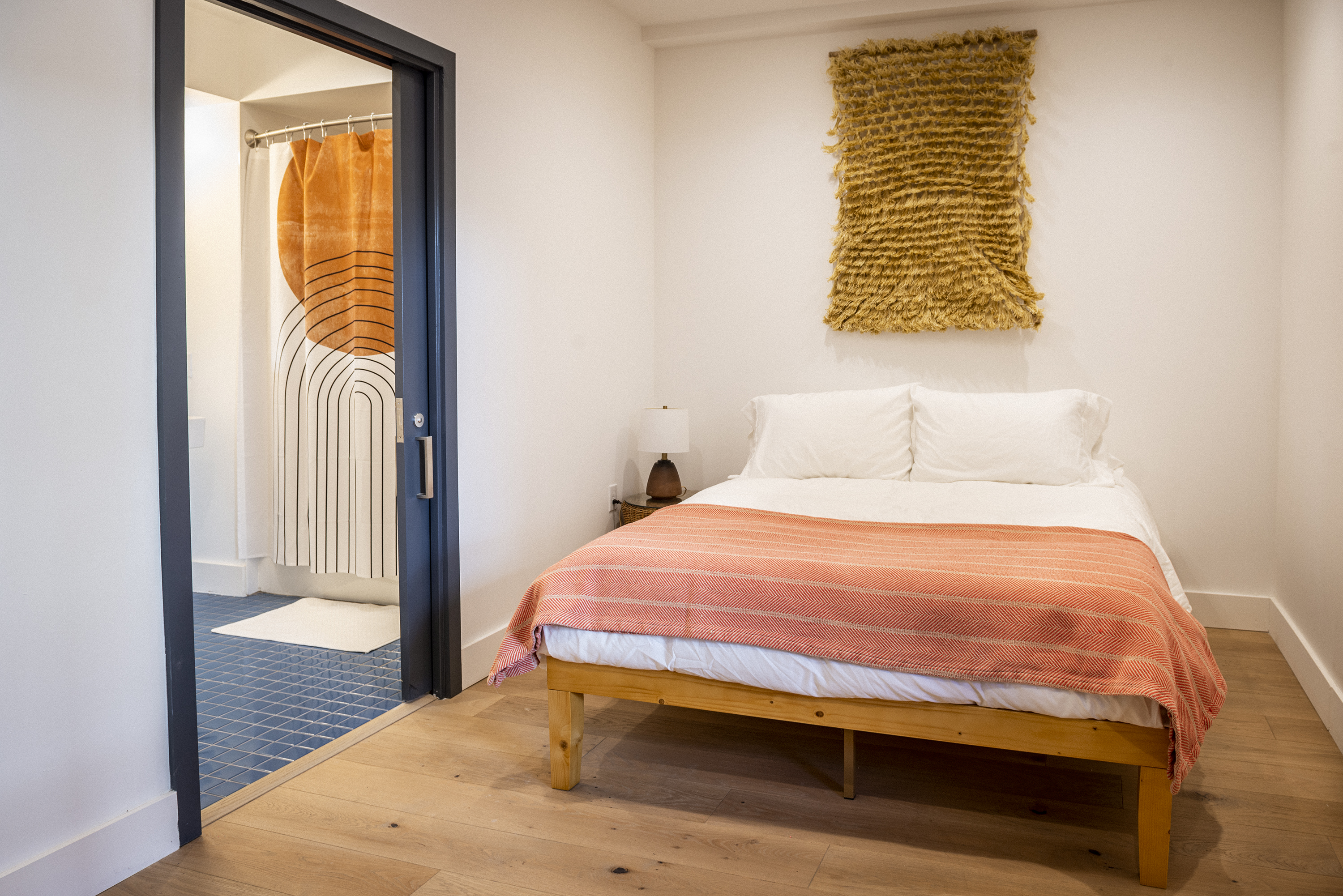 a bedroom with a bed in a room