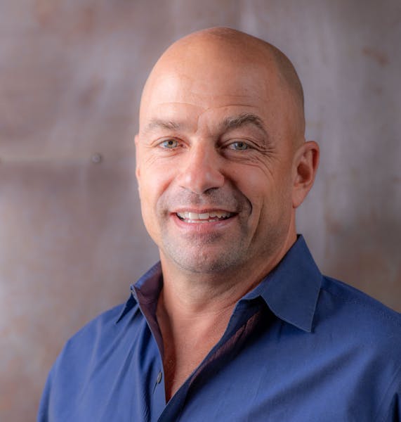 a man wearing a blue shirt