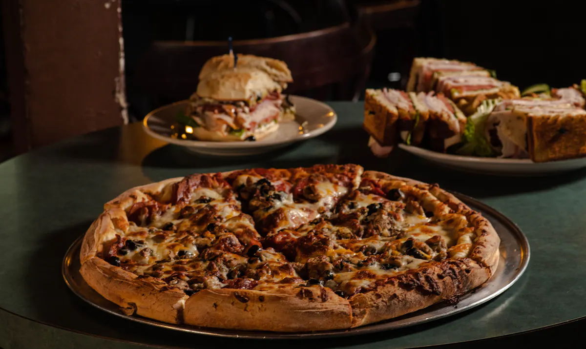 a pizza sitting on top of a table