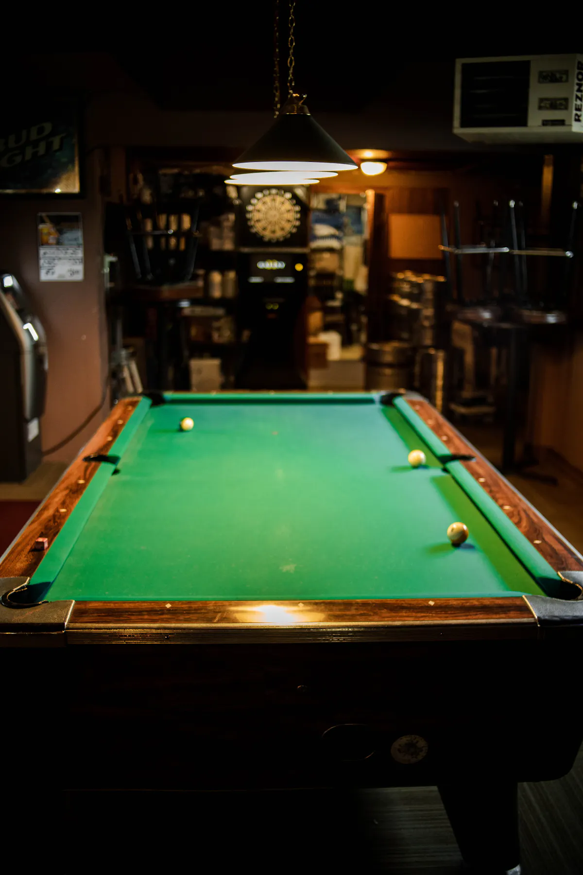 a green ball on a wooden table