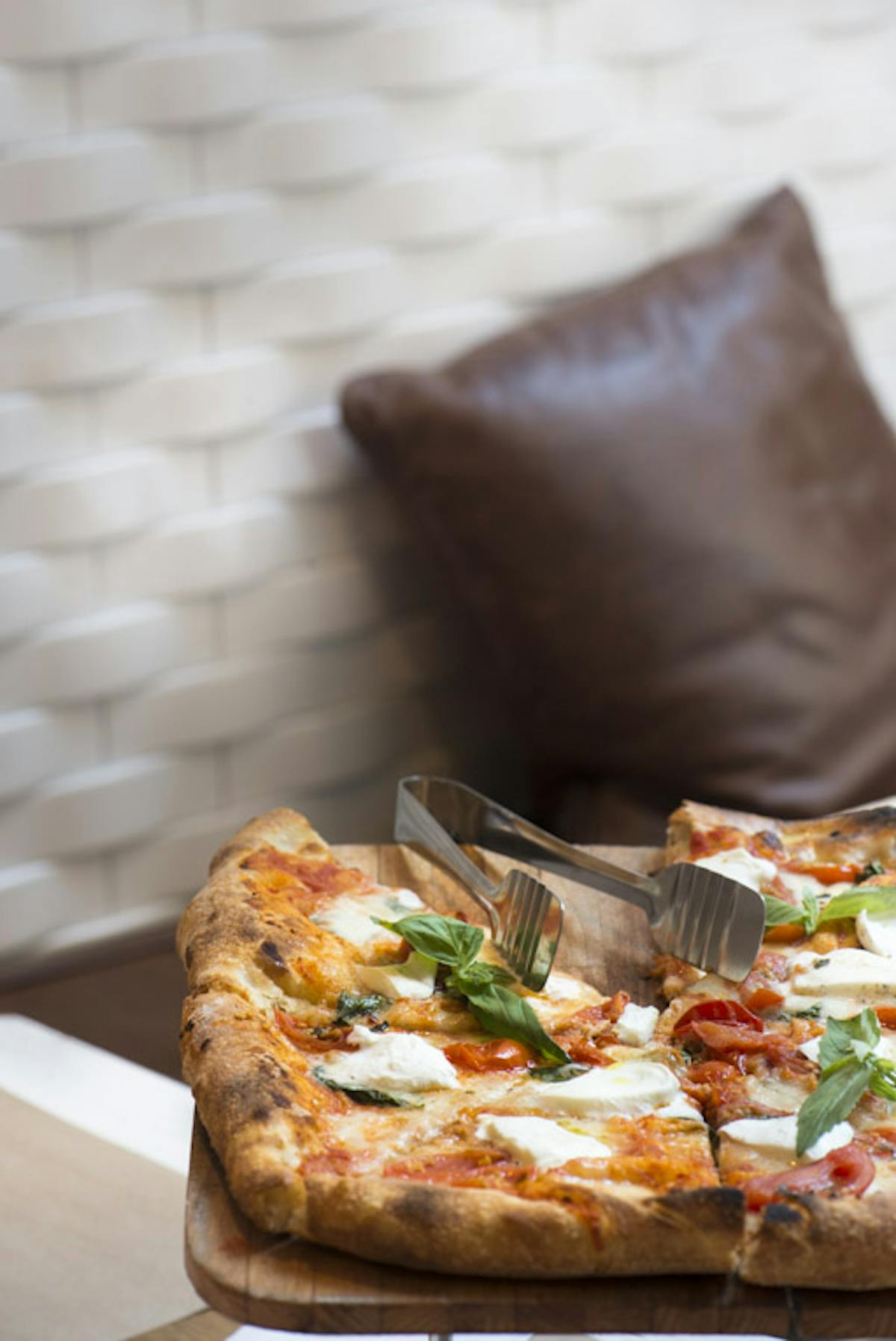 a slice of pizza sitting on top of a table