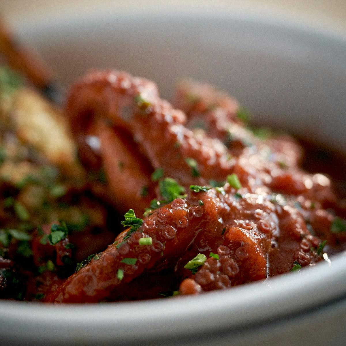 a close up of a bowl of food on a plate