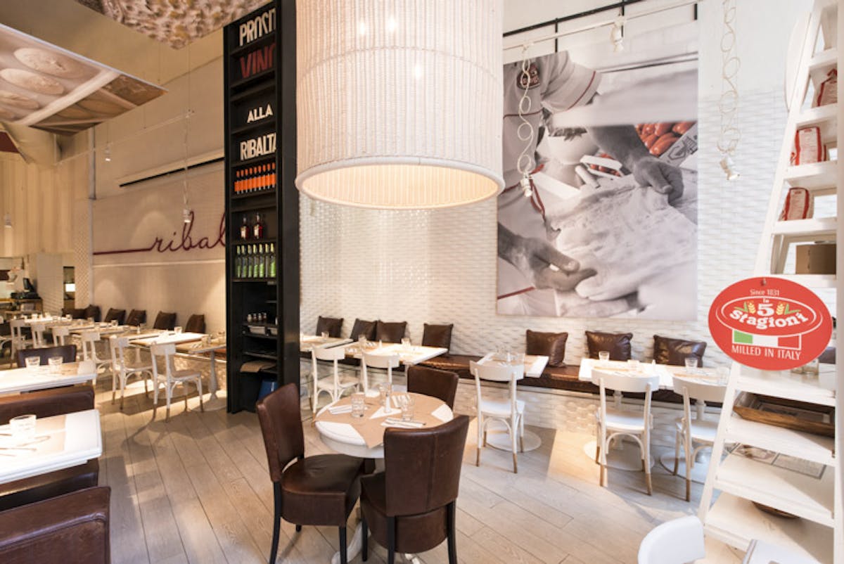 a kitchen with a table in a restaurant