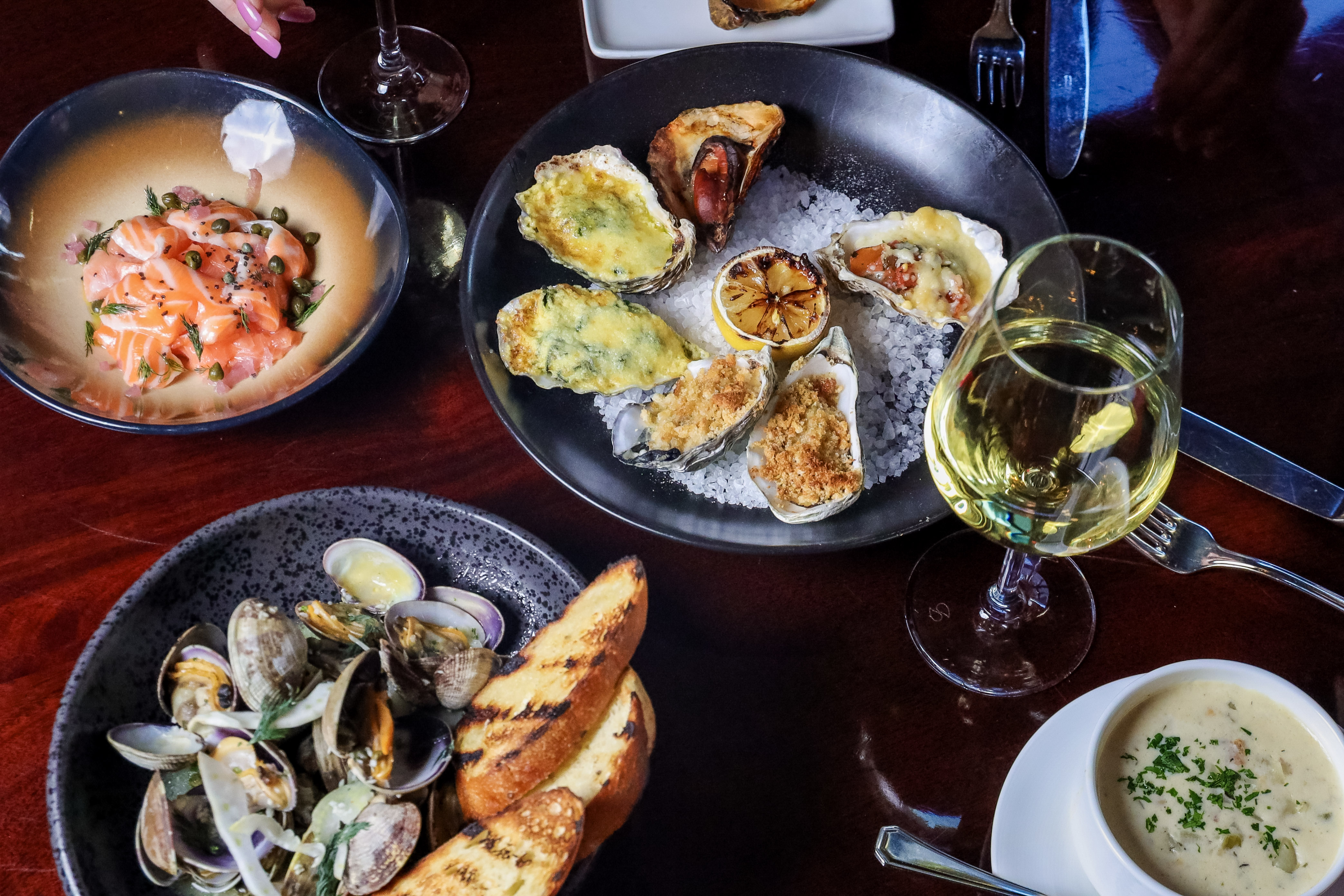 a bunch of food sitting on top of a wooden table