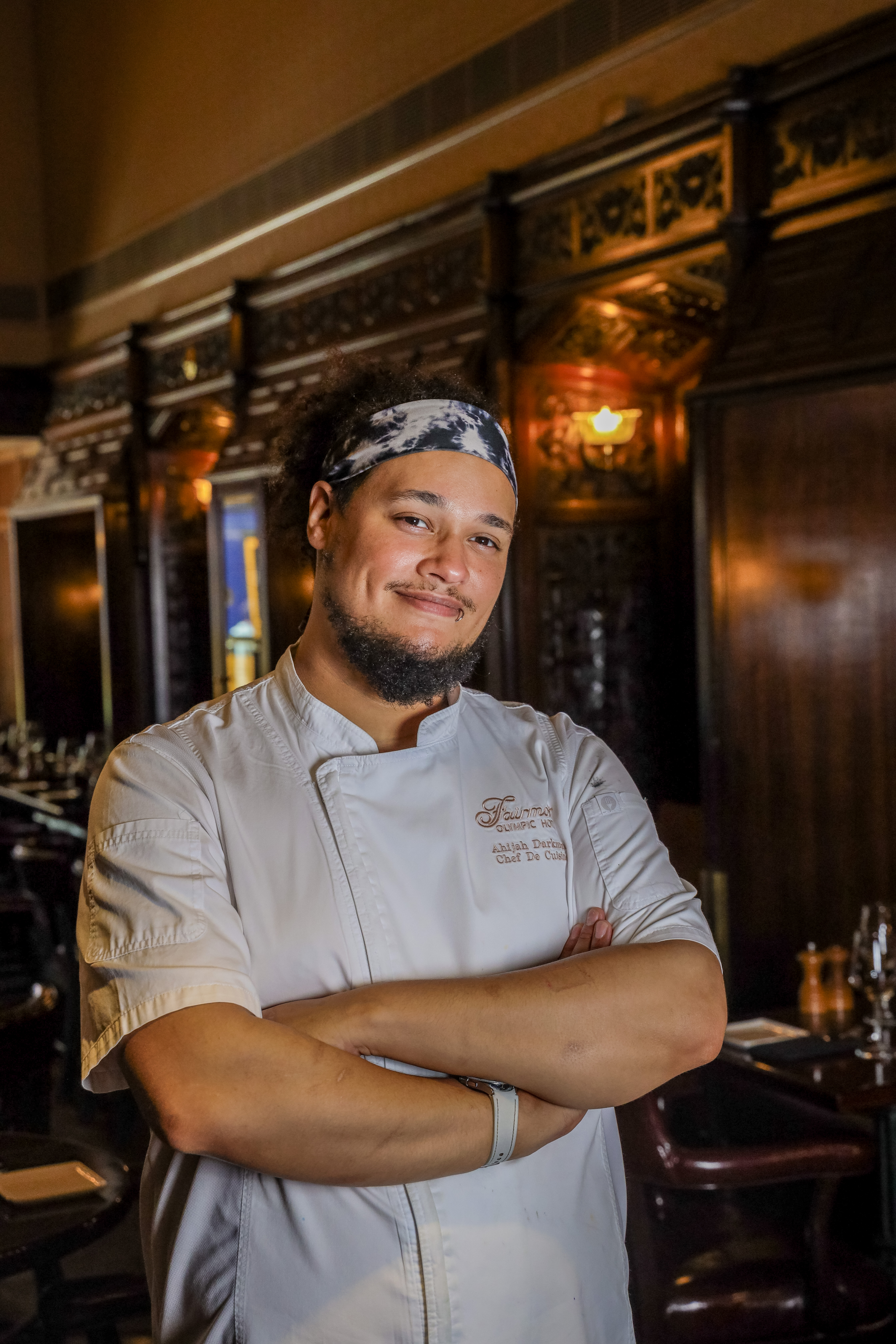 a man standing in front of a bar