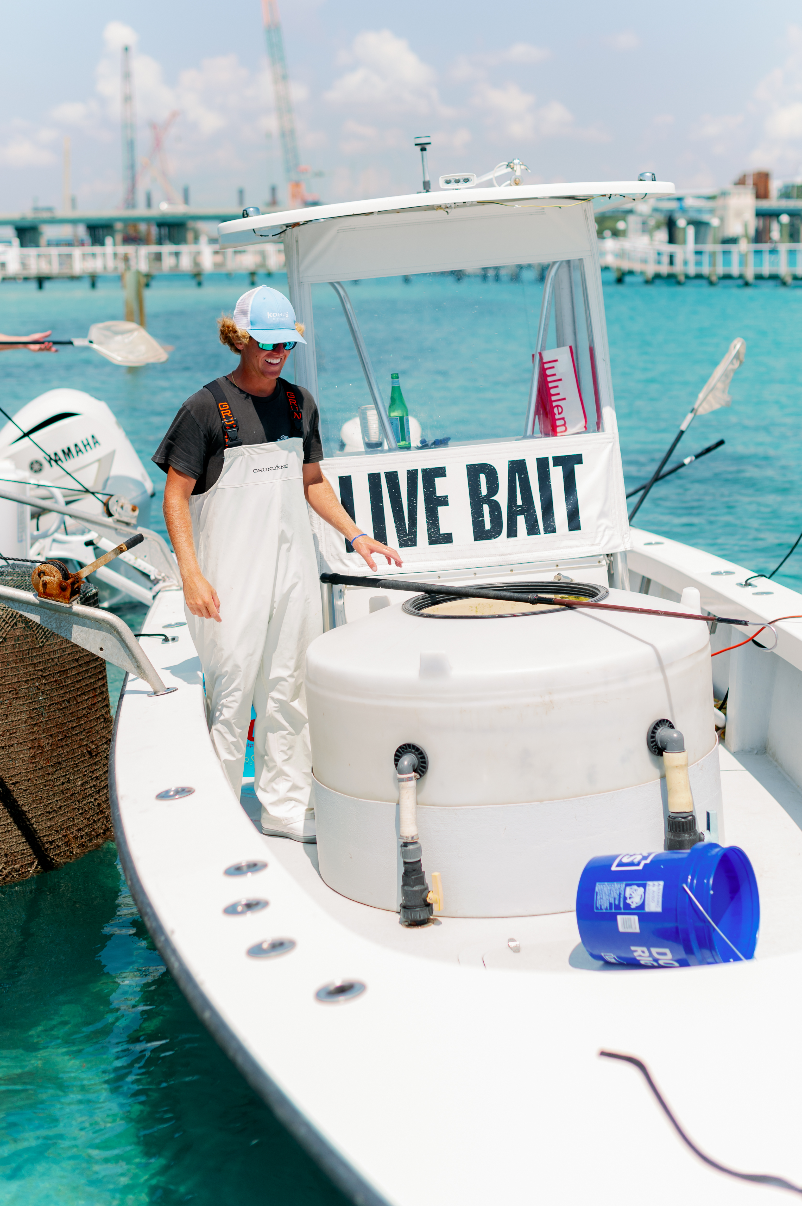 a man standing on a boat in the water