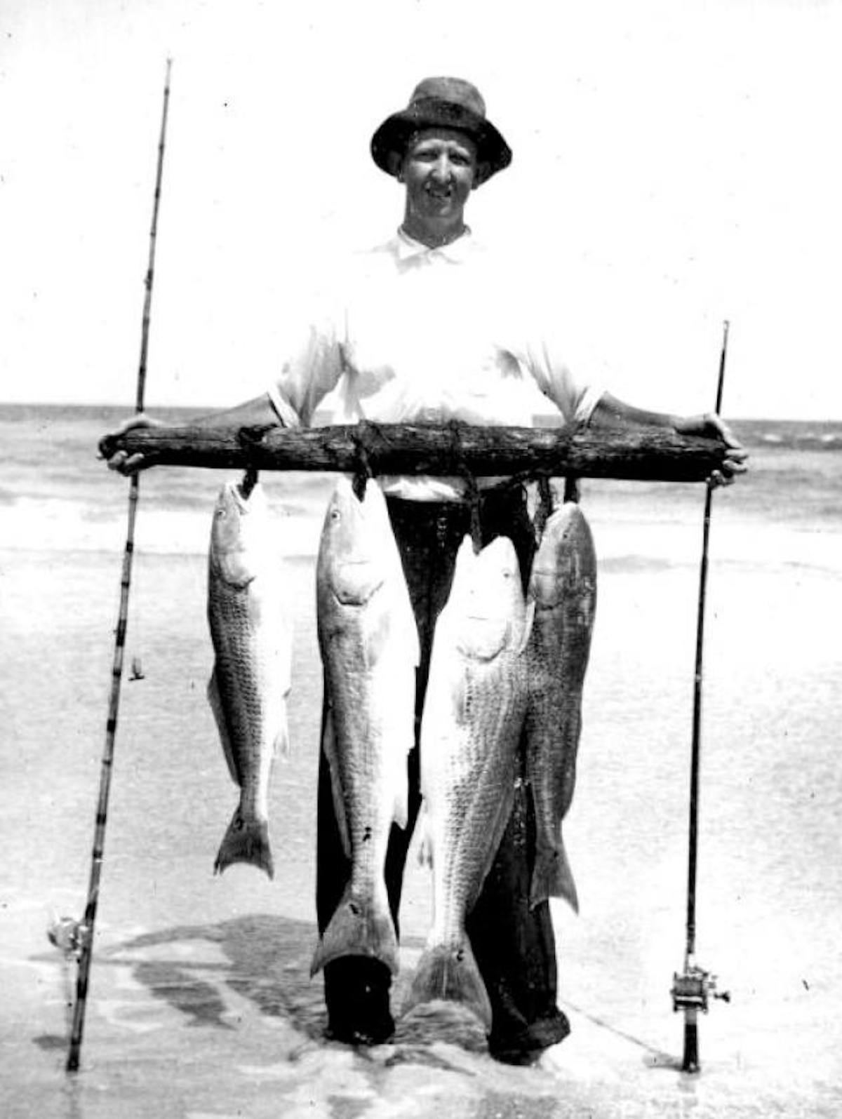 a man holding a fish