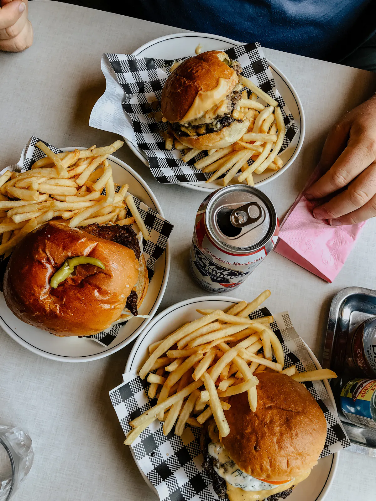 a plate of food with a sandwich and fries on a table