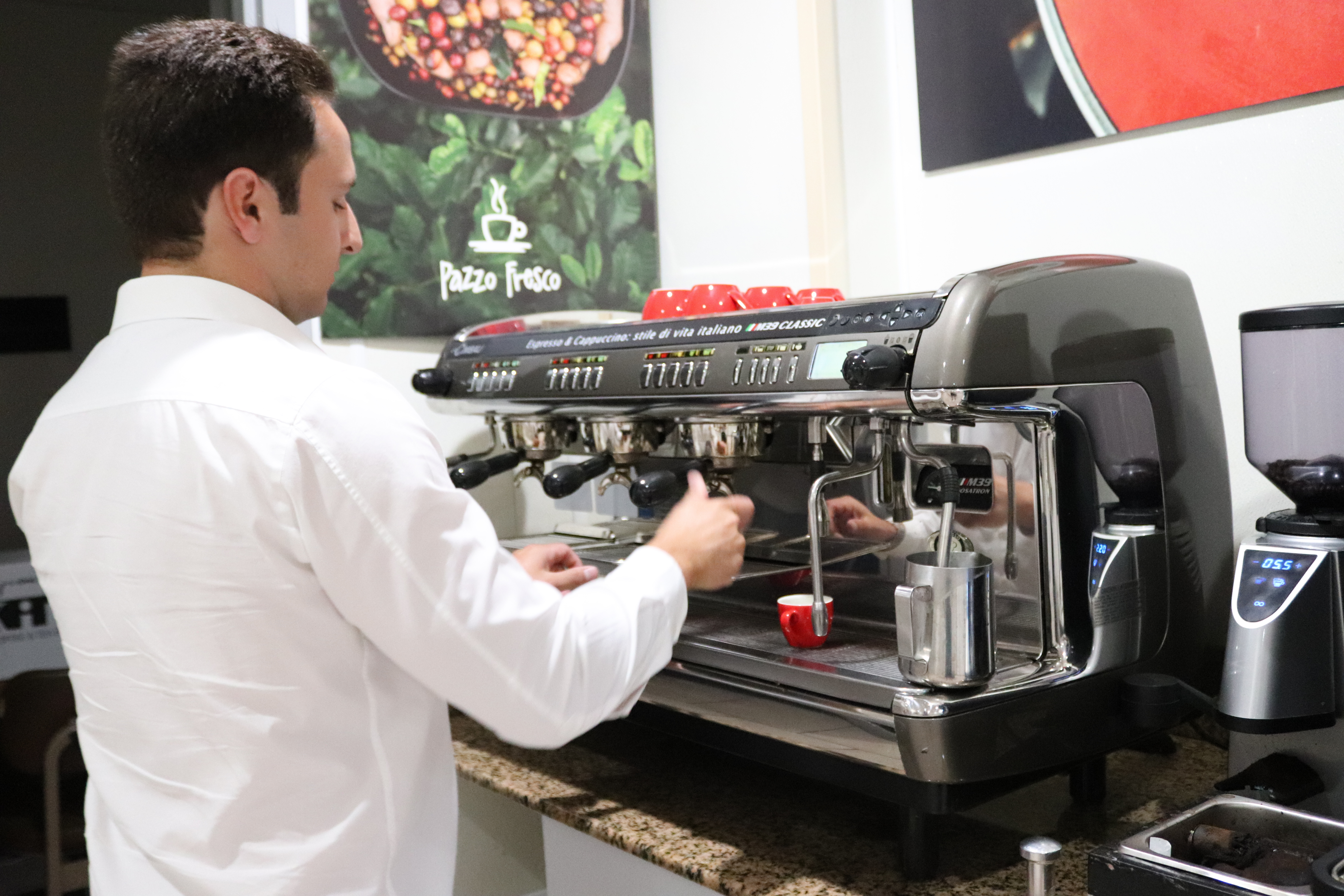a man standing in front of a car