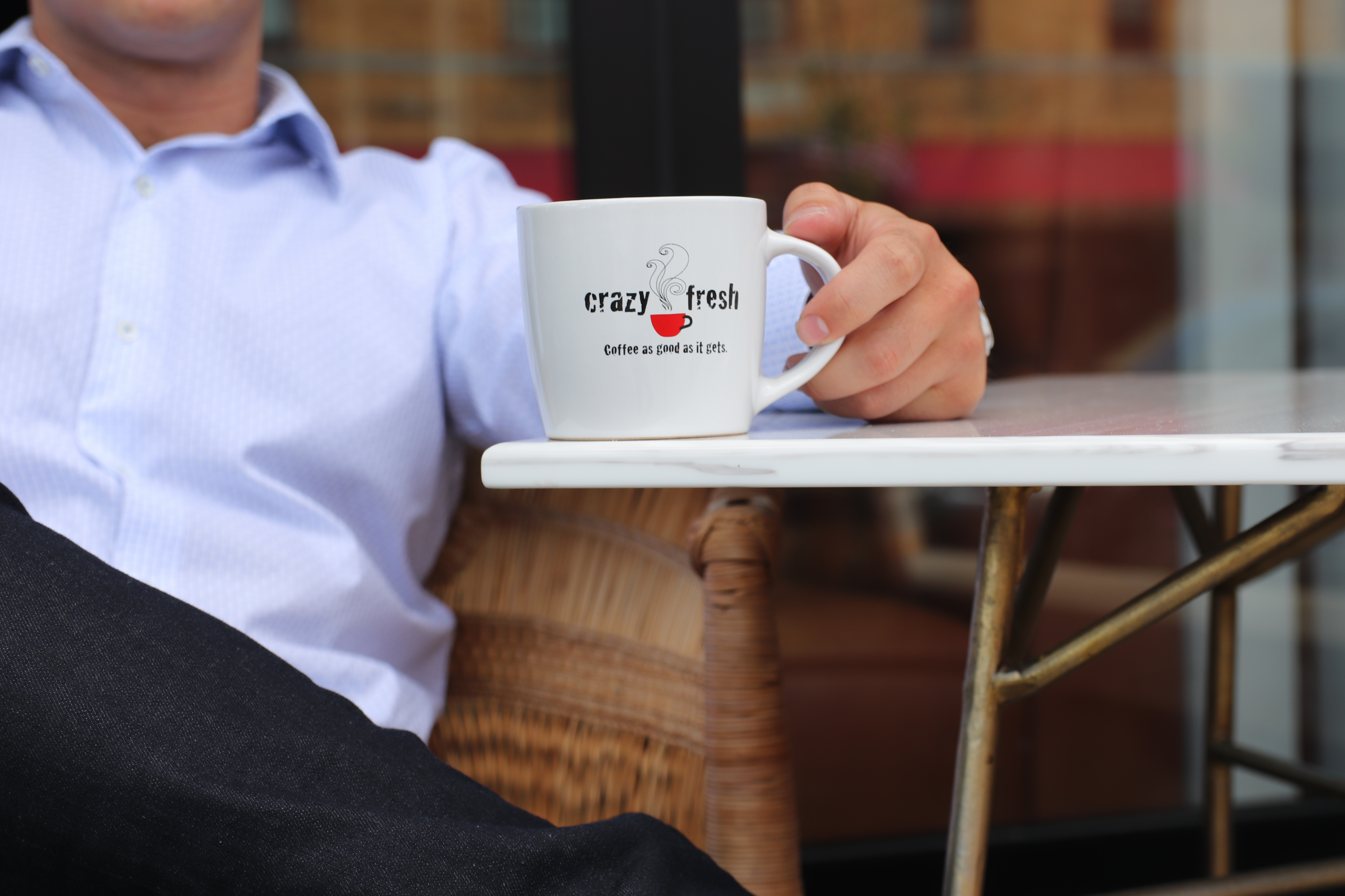a person sitting at a table using a laptop