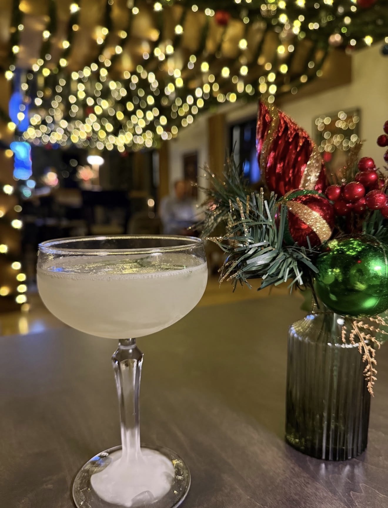 a glass of drink on a table