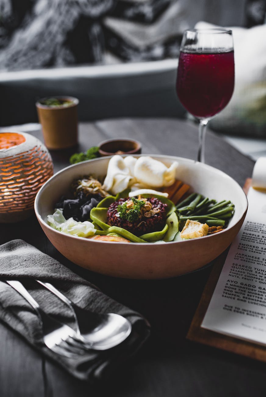 a bowl of food sitting on a table