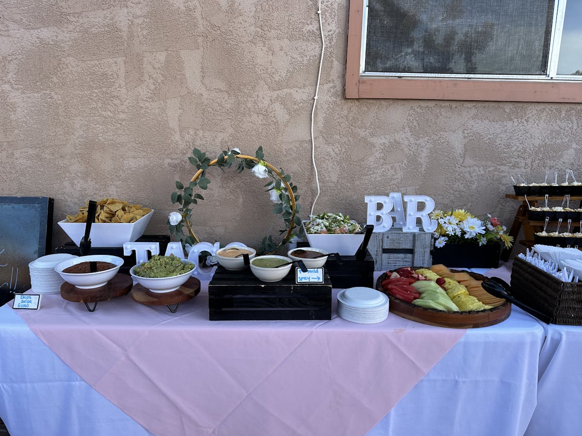 a table with a vase of flowers sitting on top of a building