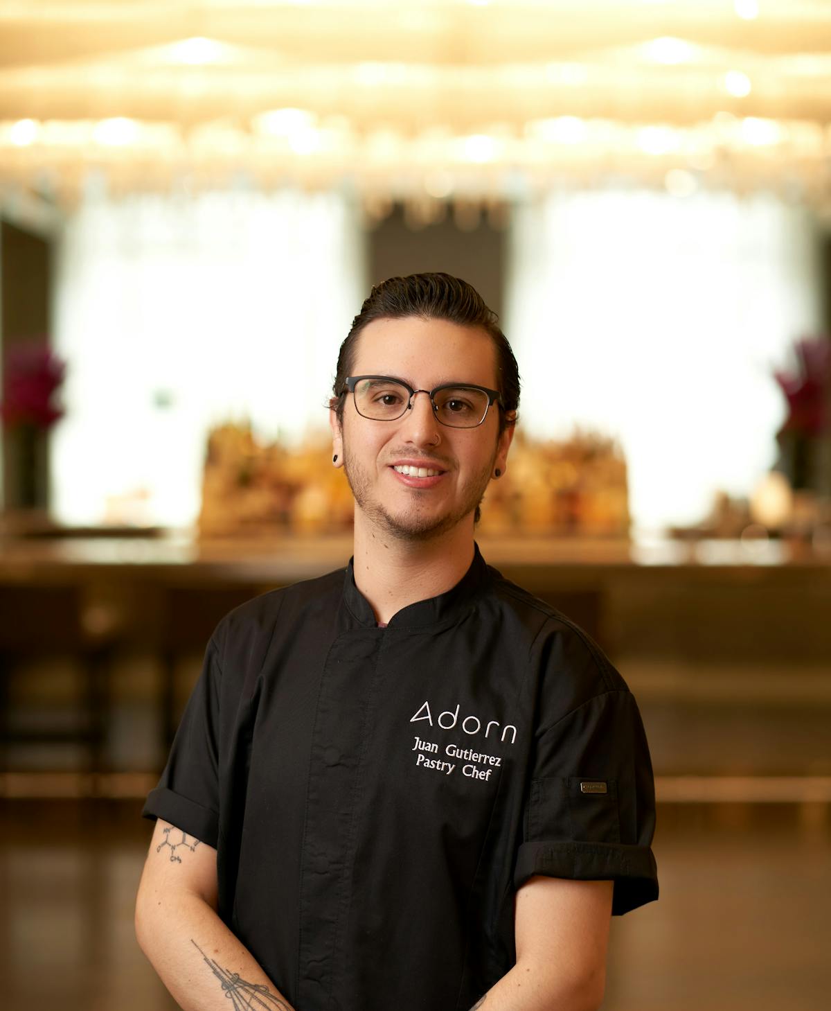 Arayik Shahbazian standing in front of a table