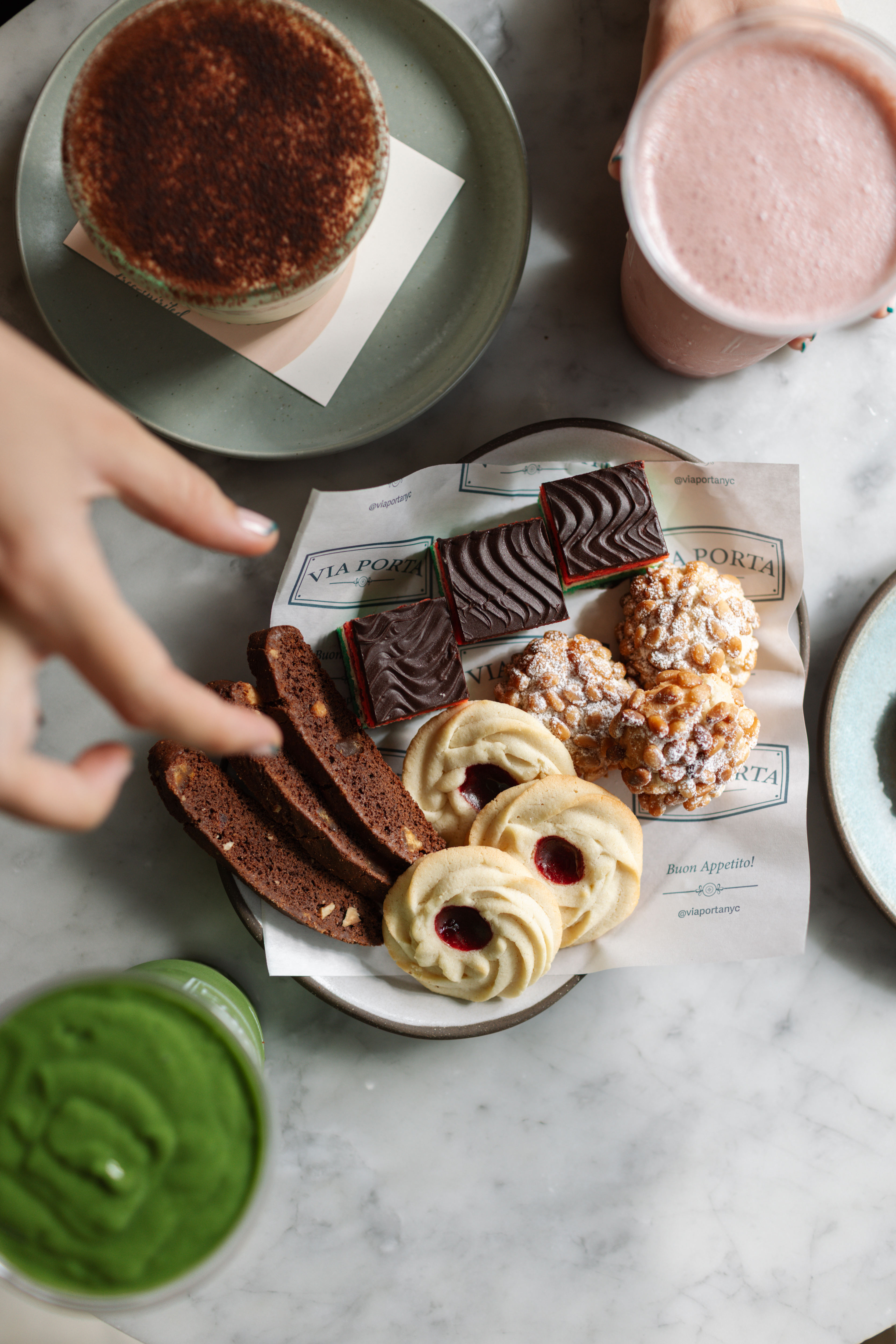 a plate of cookies and chocolates