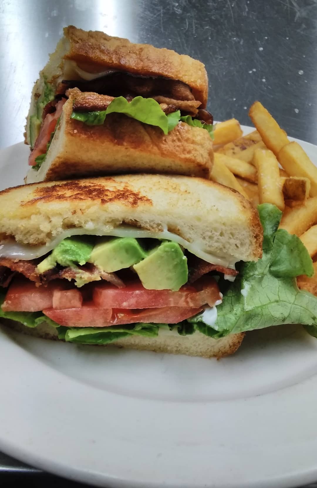 a sandwich cut in half on a plate