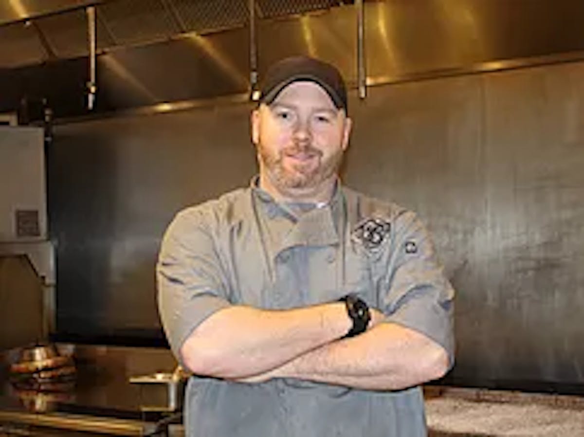 a man standing in a kitchen