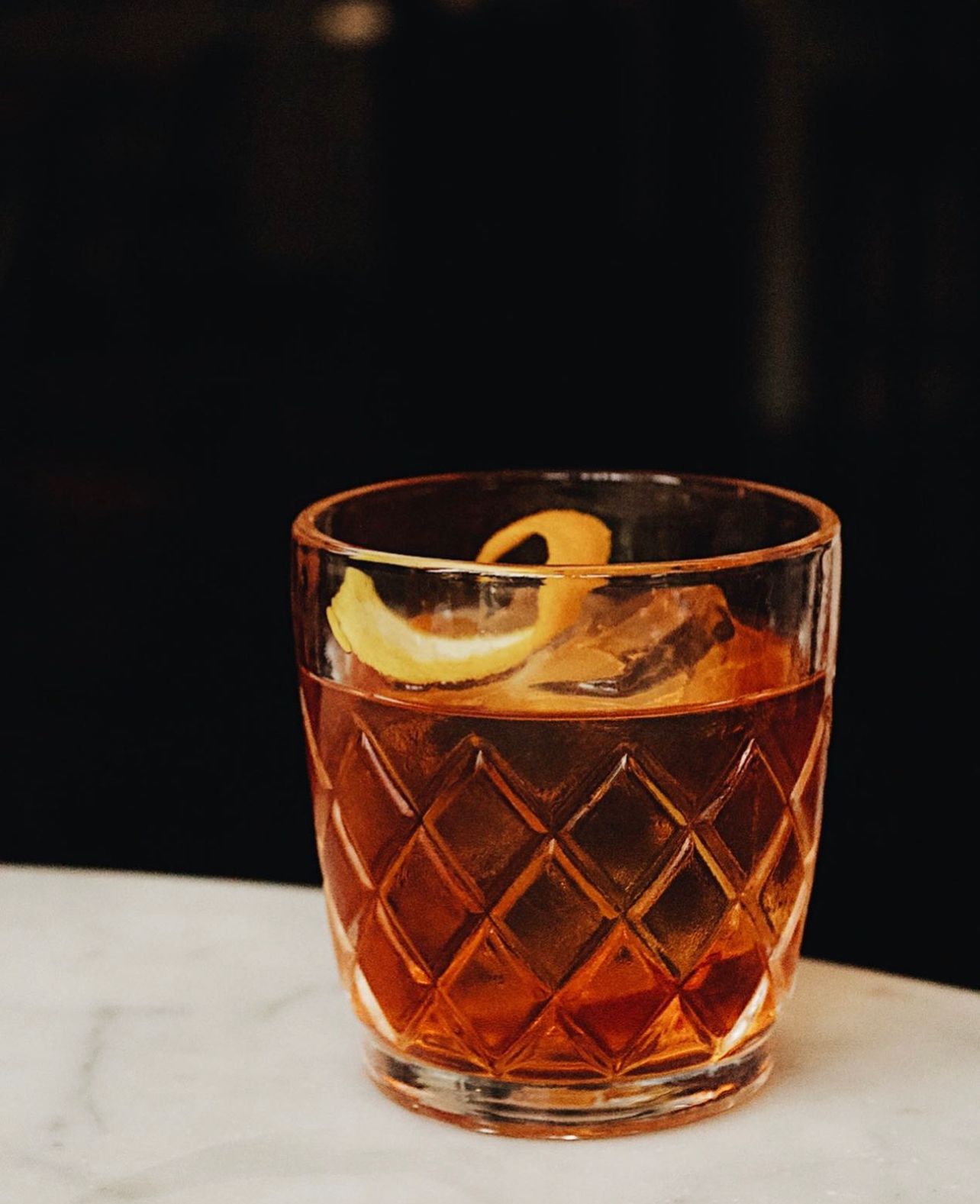 a cup of coffee and a glass of beer on a table