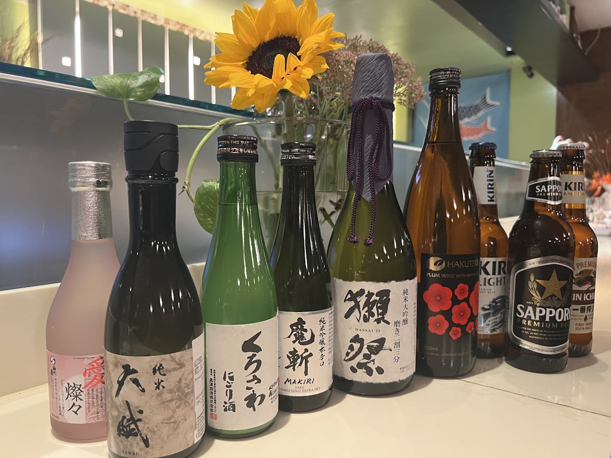 bottles of wine and sake on a table