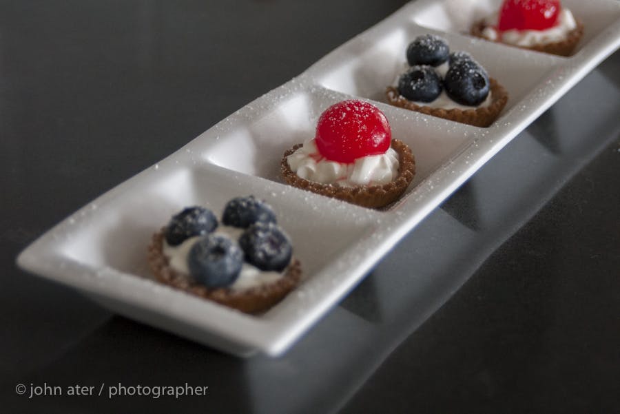 a plate with bite size desserts