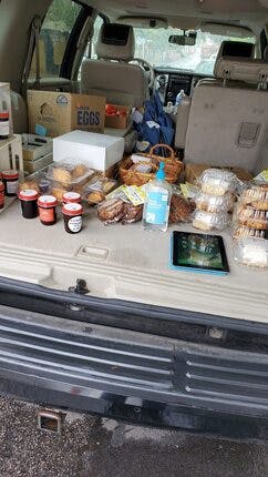 a bunch of luggage stacked on top of a counter