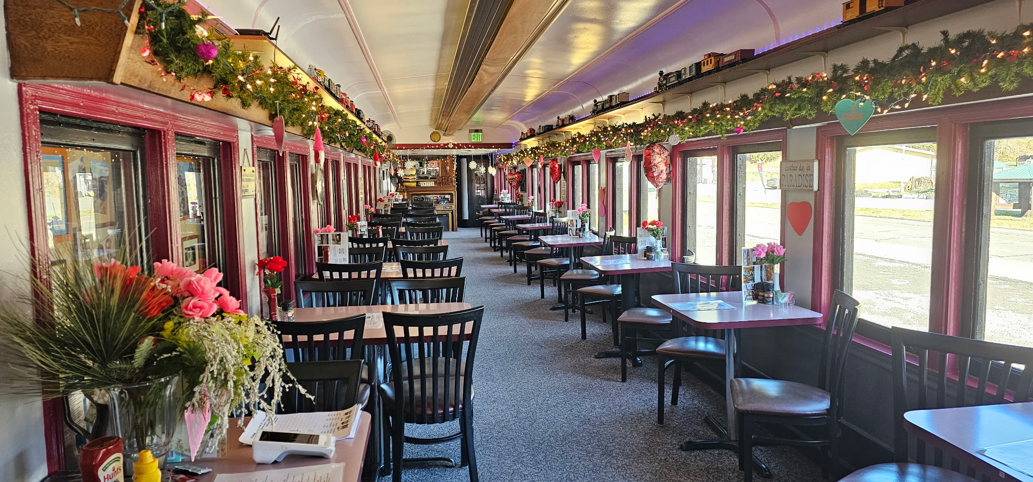 a restaurant with tables and chairs