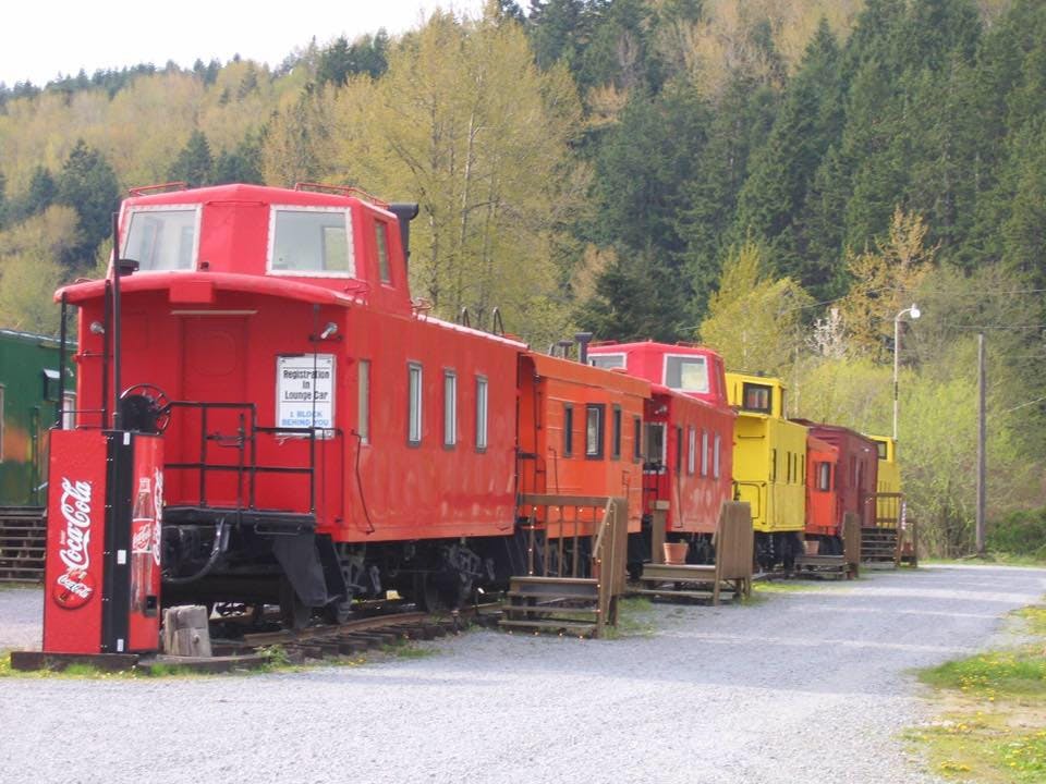 a train engine carrying carts down a track