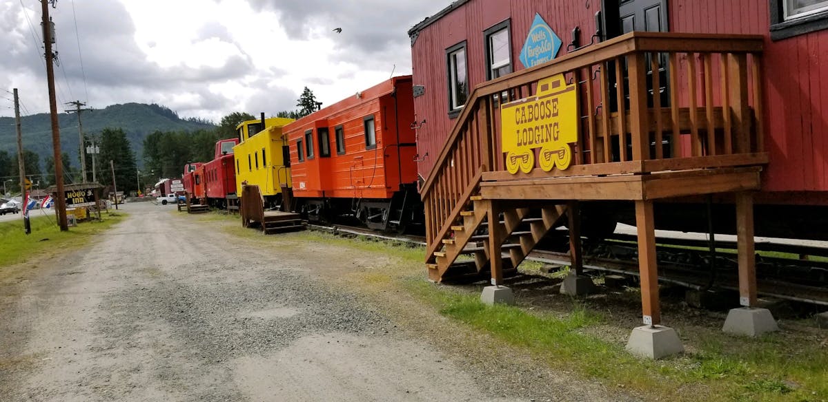 a train is parked on the side of the road