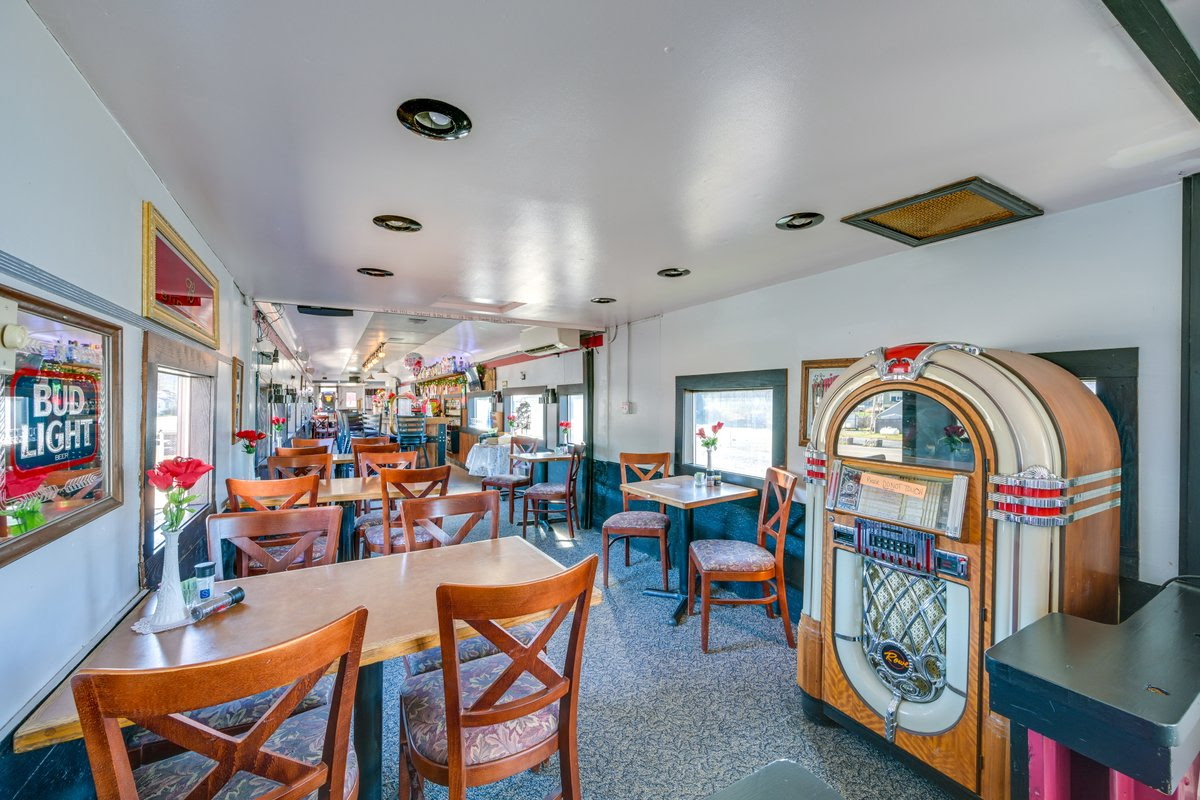 a room with tables and chairs