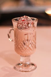 a glass cup on a table