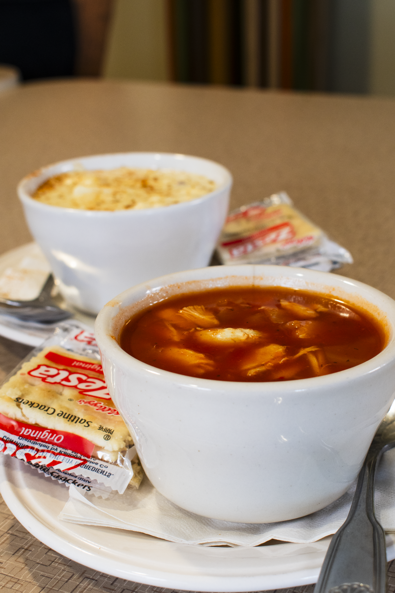 a plate of food and a cup of coffee