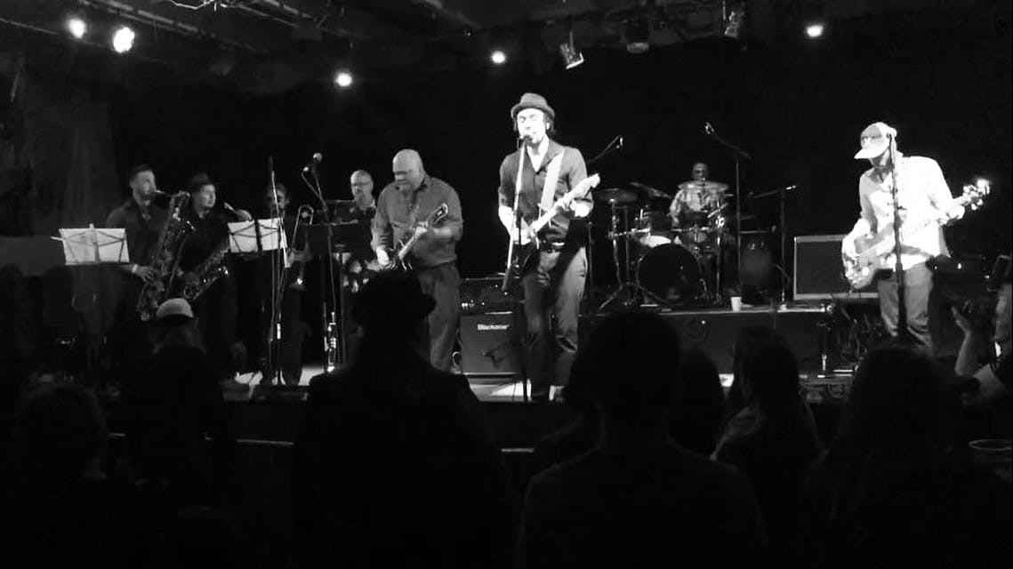 a group of people standing in front of a crowd