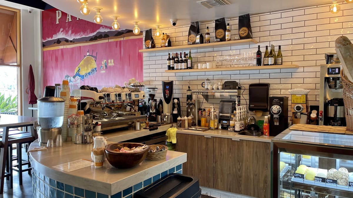 a kitchen with a table in a restaurant