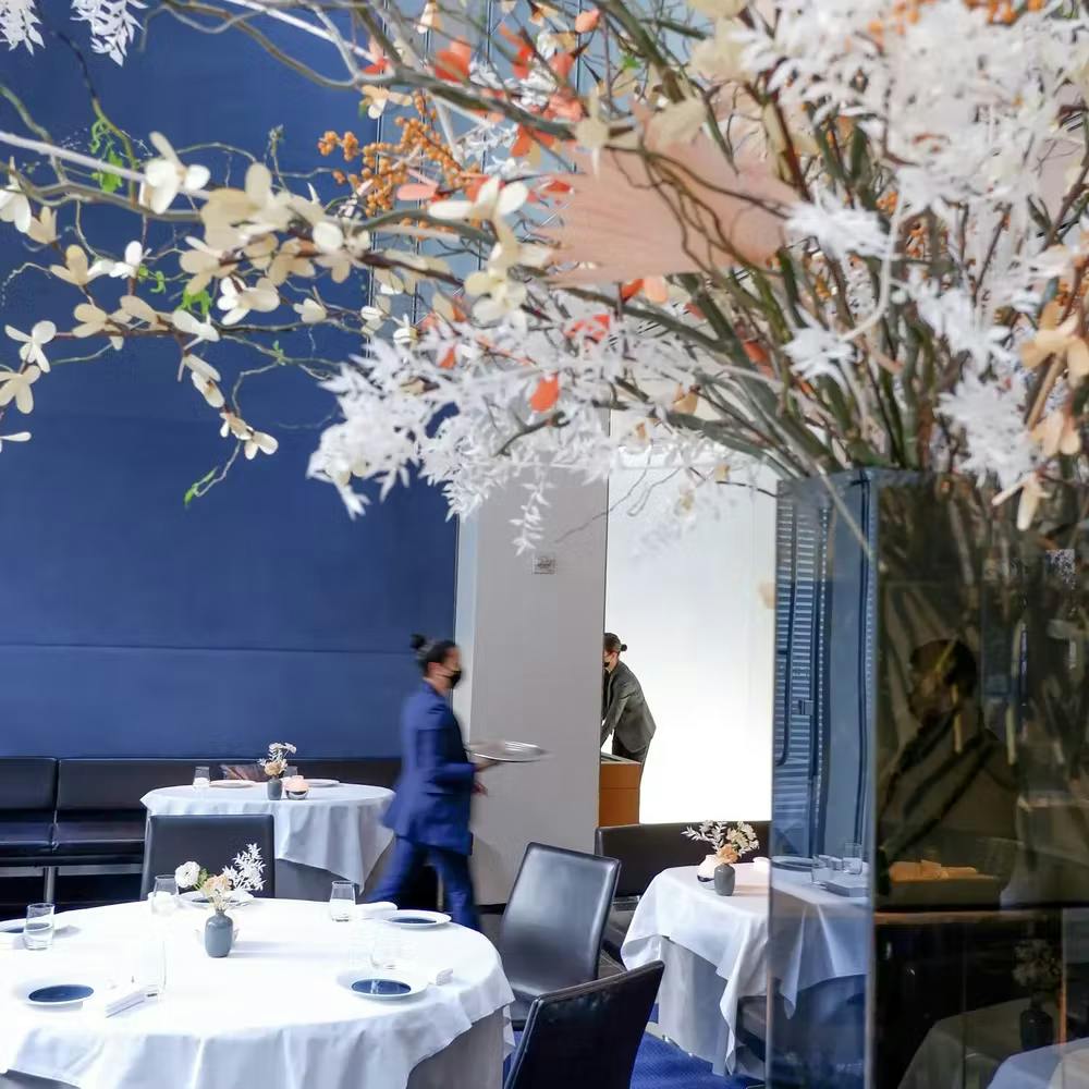 a person standing in front of a mirror posing for the camera